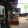 Photos: Three Injured After Truck Plows Into Sunnyside Grocery Store 